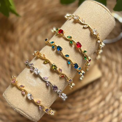 Set of colorful beaded bracelets on a beige roll with a natural background
