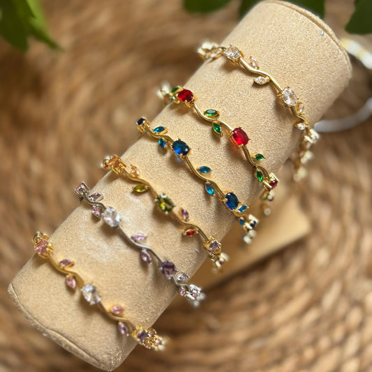 Set of colorful beaded bracelets on a beige roll with a natural background